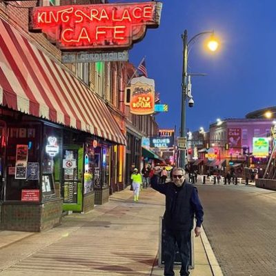 Mark Montgomery waving on Beale Street outside the Kings Palace