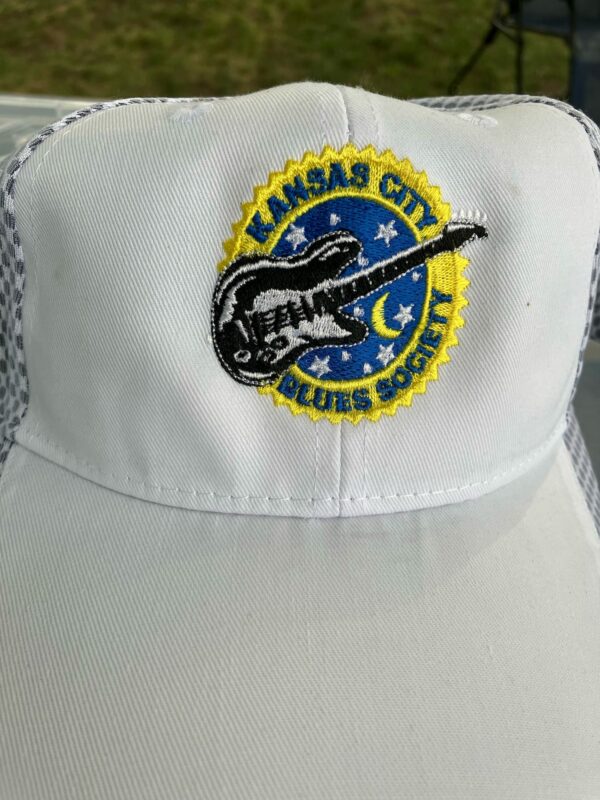 white baseball cap with KCBS guitar logo