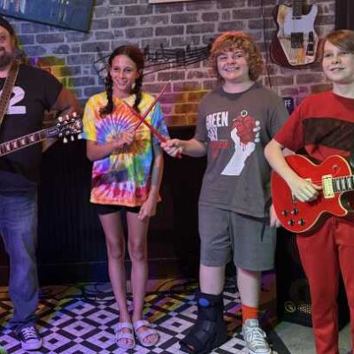 Coyote Bill with young musicians